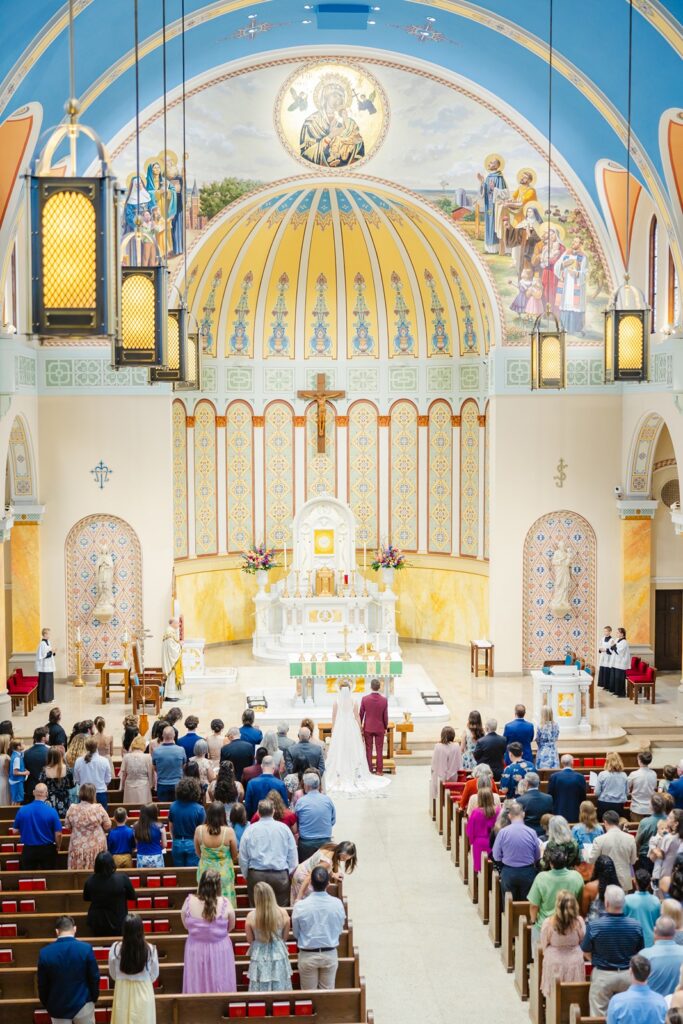 balcony view of a wedding ceremony at our ladys cathedral okc